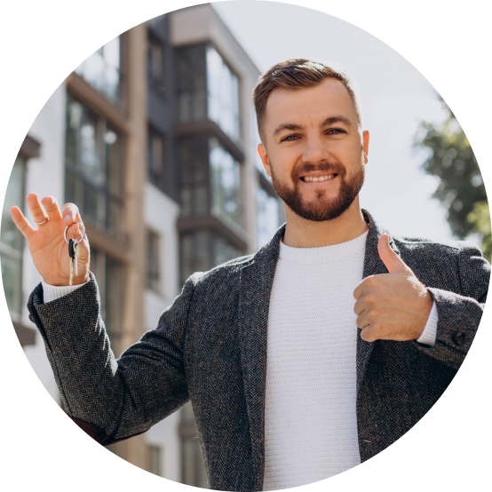 Happy man holding a house key